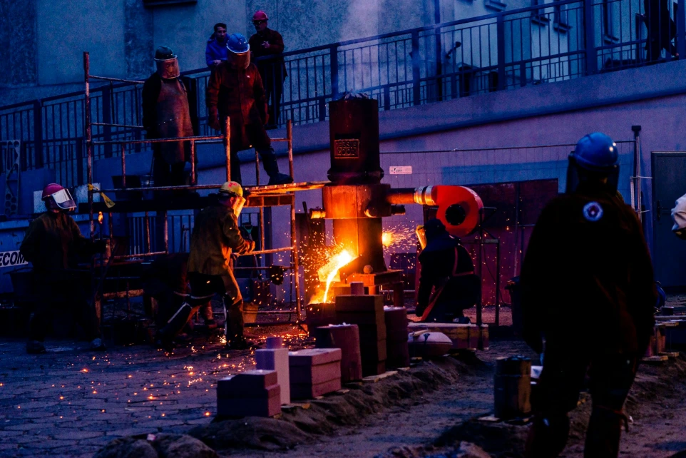 a group of people standing around a fire
